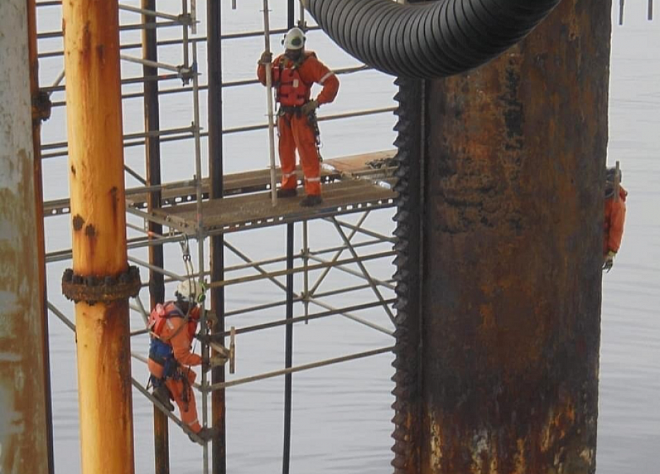 Term of highly trained and skilled Workers in the act of facility maintenance against corrosion and decays
